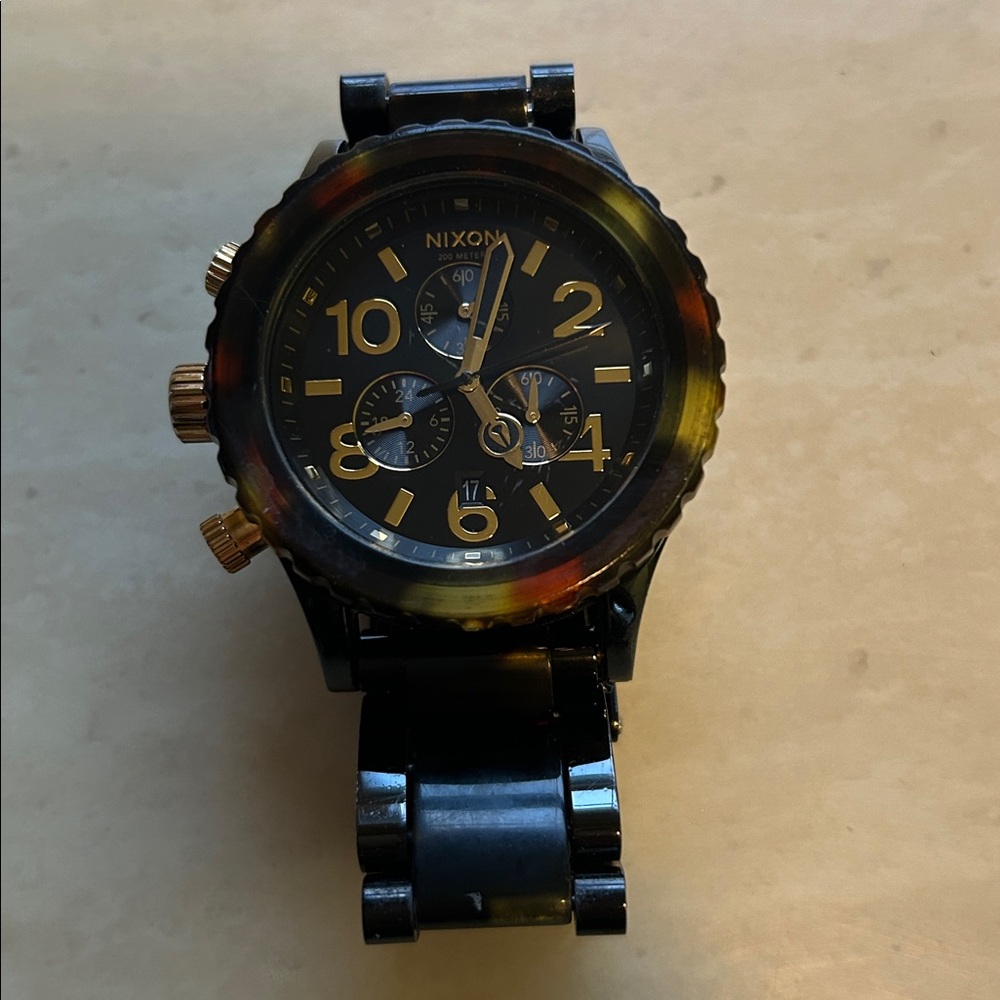 Nixon Black and Gold tortoise shell watch